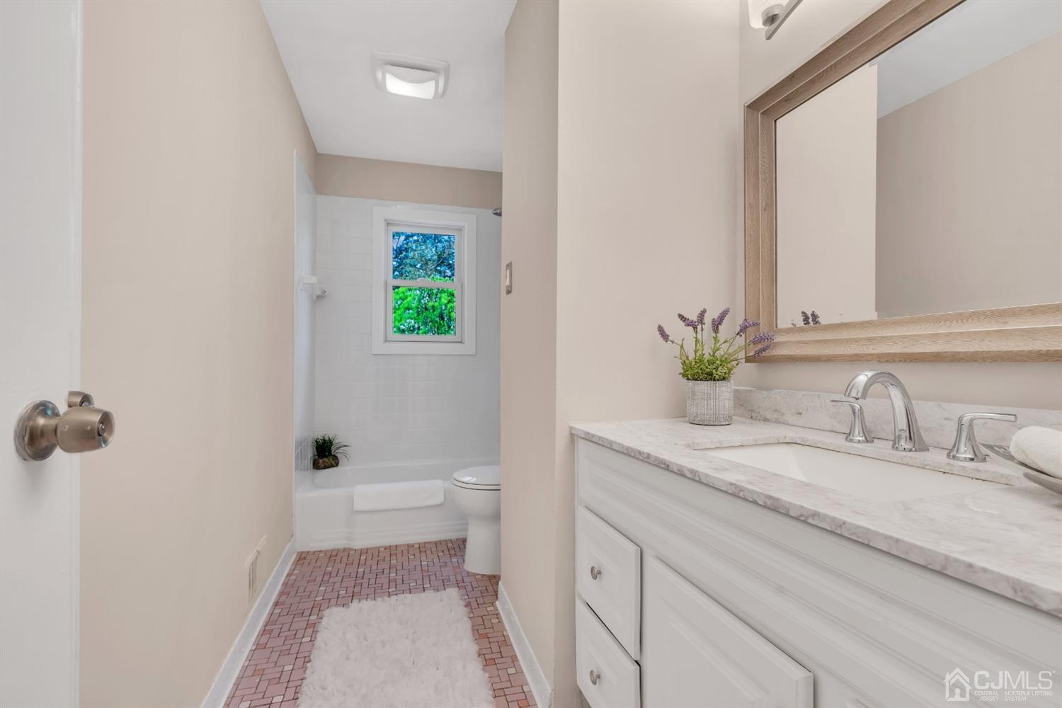 9 Valiant Road East Brunswick, NJ 08816 - Photo 34 of 41 a bathroom with a granite countertop sink toilet and shower