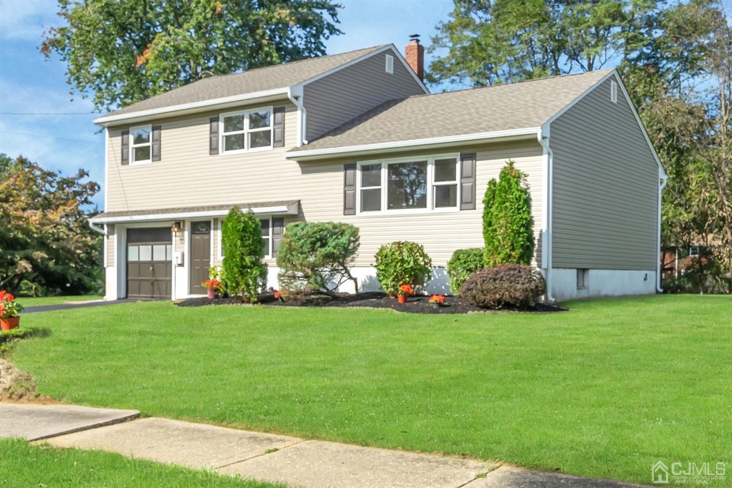 9 Valiant Road East Brunswick, NJ 08816 - Photo 41 of 41 a front view of a house with a garden