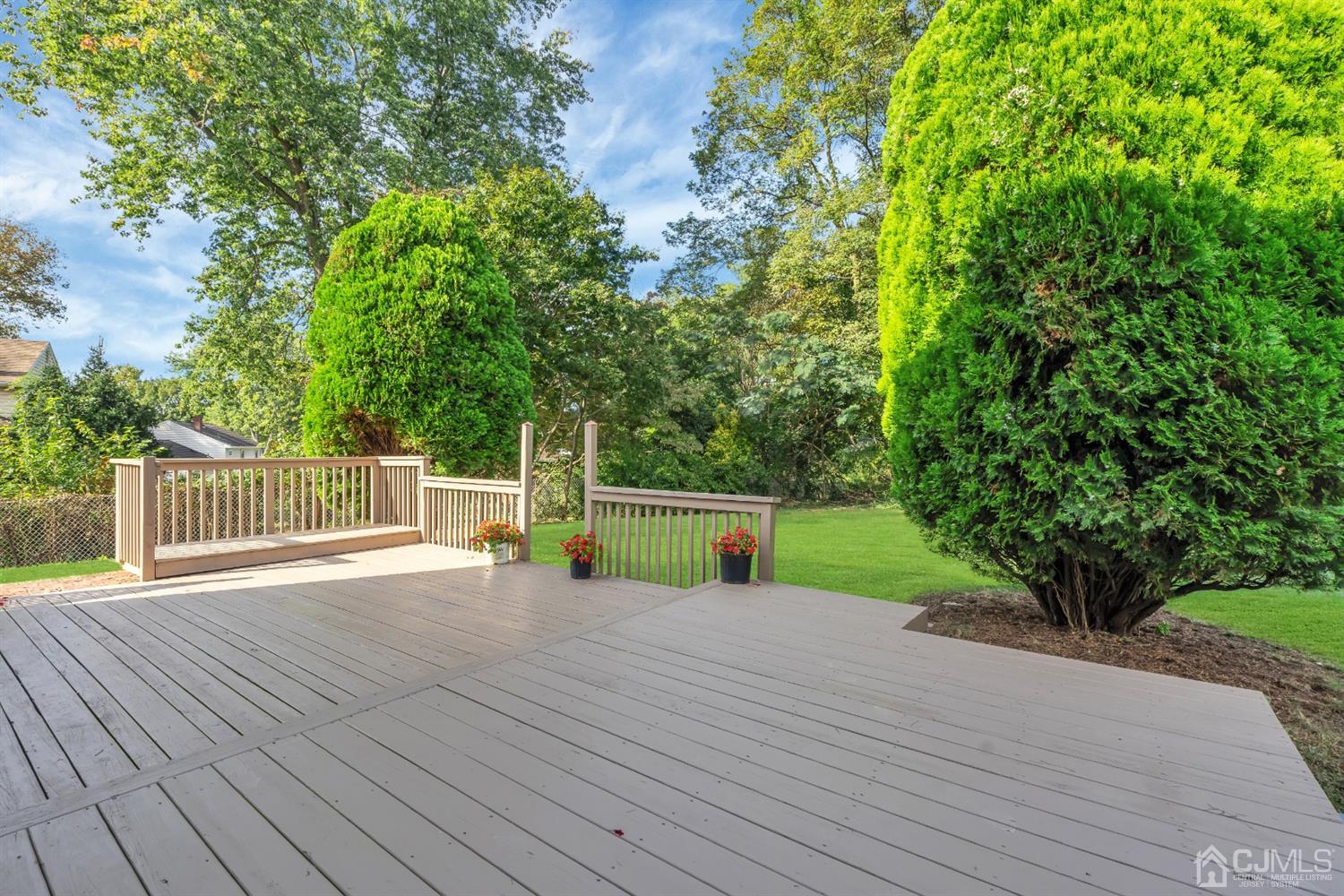 9 Valiant Road East Brunswick, NJ 08816 - Photo 6 of 41 a view of a deck and yard with wooden fence