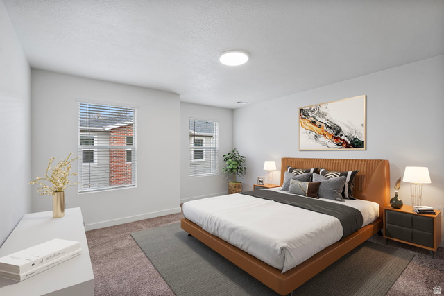 445 950 South Ogden, UT 84404 - Photo 16 of 28 Carpeted bedroom featuring baseboards and a textured ceiling