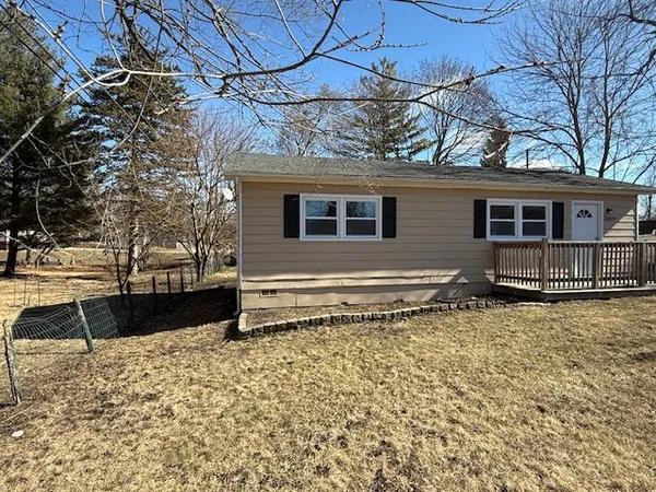 a front view of house with a yard