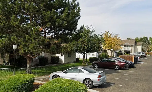 a view of a cars parked in front of a house
