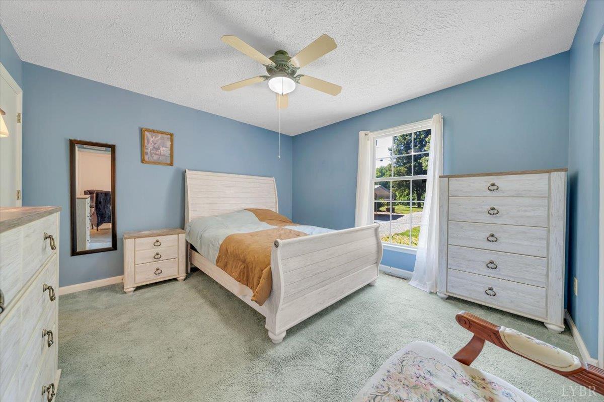 1124 Homeplace Road Bedford, VA 24523 - Photo 20 of 47 a bed room with a bed and a dresser