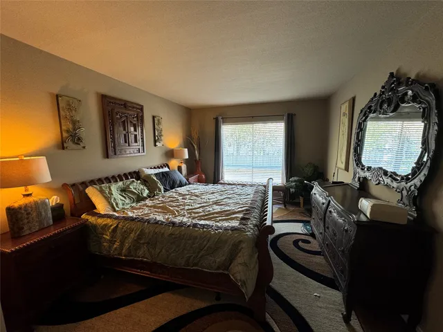 a bedroom with double bed and a window