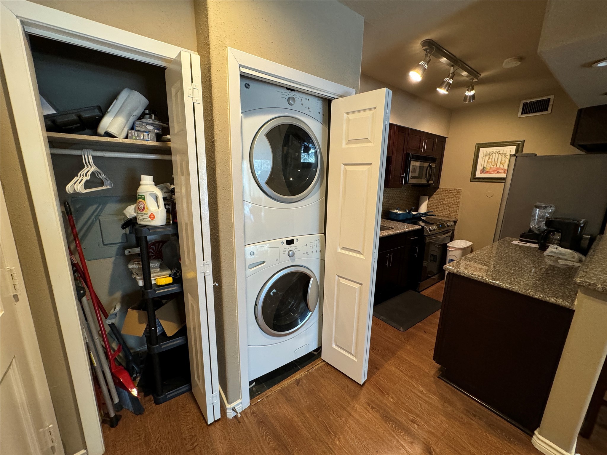 2220 South Piney Point Road, Unit 208 Houston, TX 77063 - Photo 8 of 10 a living room with dryer and washer