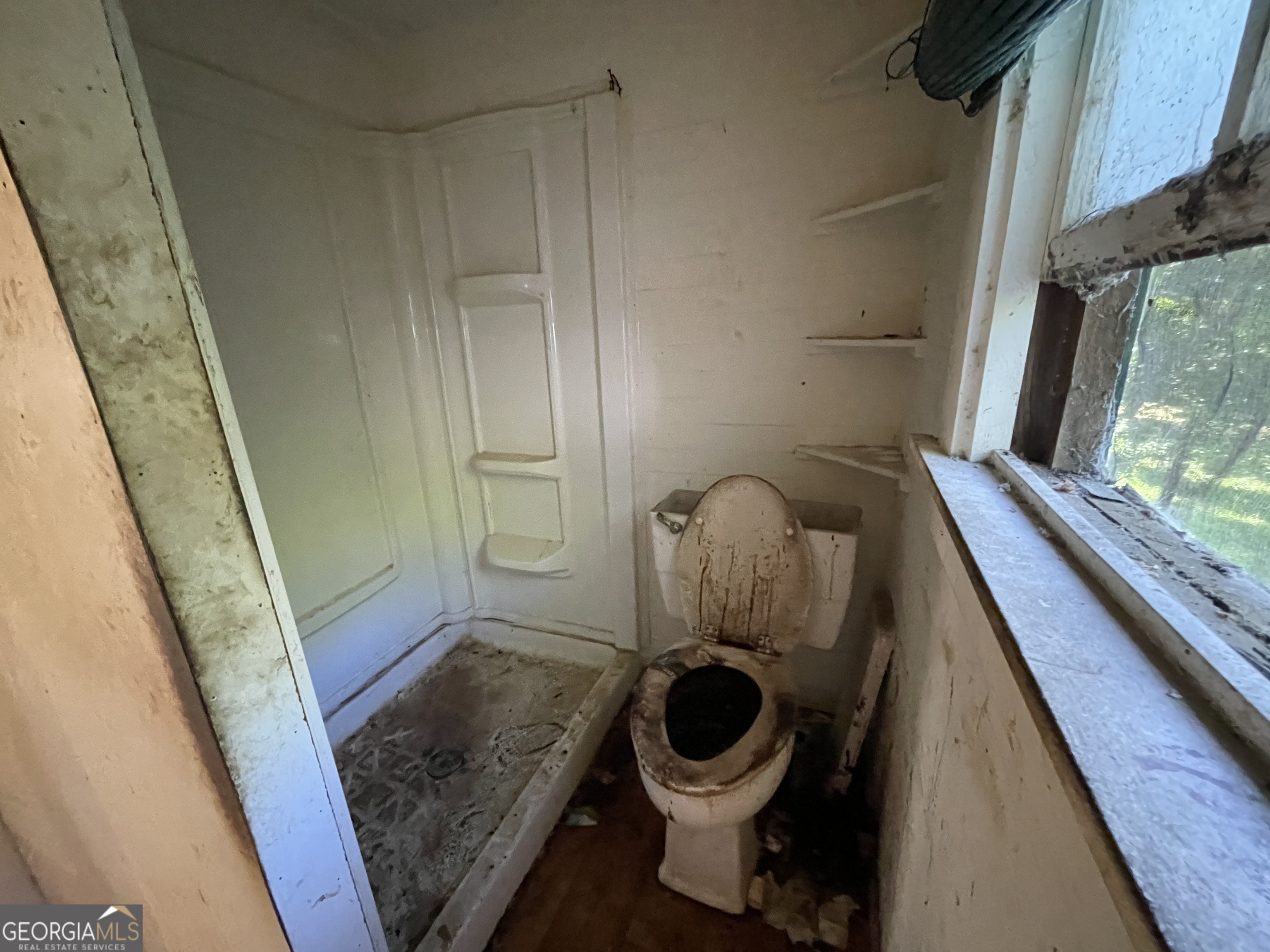 129 7th Street Cochran, GA 31014 - Photo 12 of 18 a bathroom with a sink and toilet
