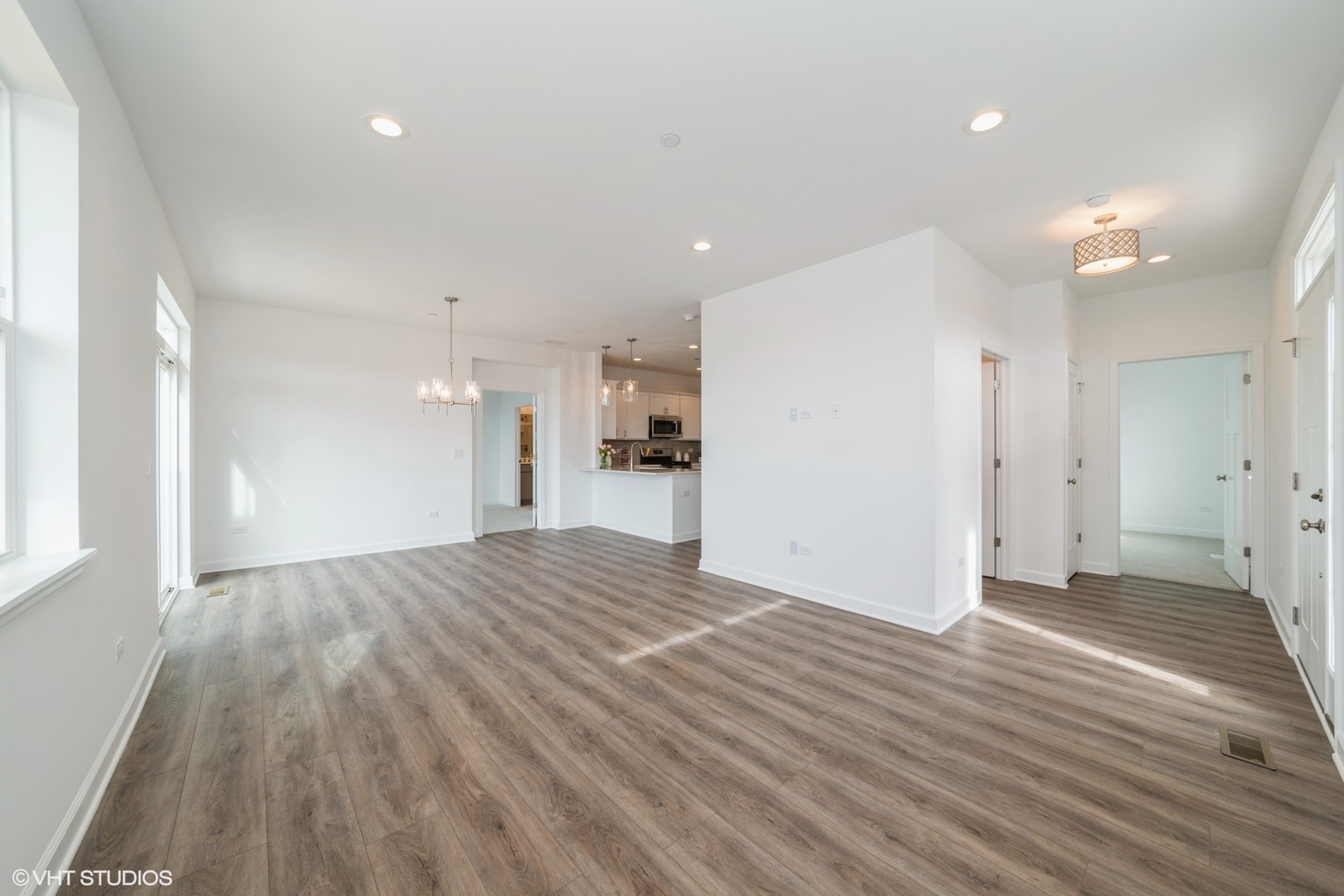 385 Masters Drive Addison, IL 60101 - Photo 3 of 17 a view of a big room with wooden floor and a window
