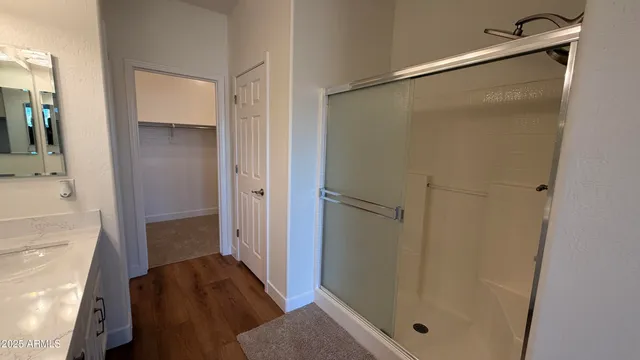 a bathroom with a tub and shower