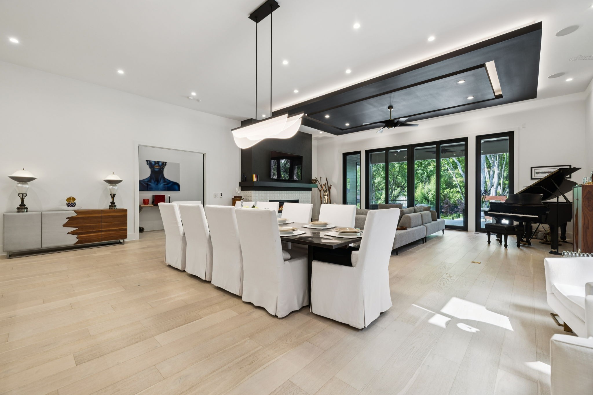 3916 Harding Place Nashville, TN 37215 - Photo 19 of 85 a living room with furniture a flat screen tv and a large window