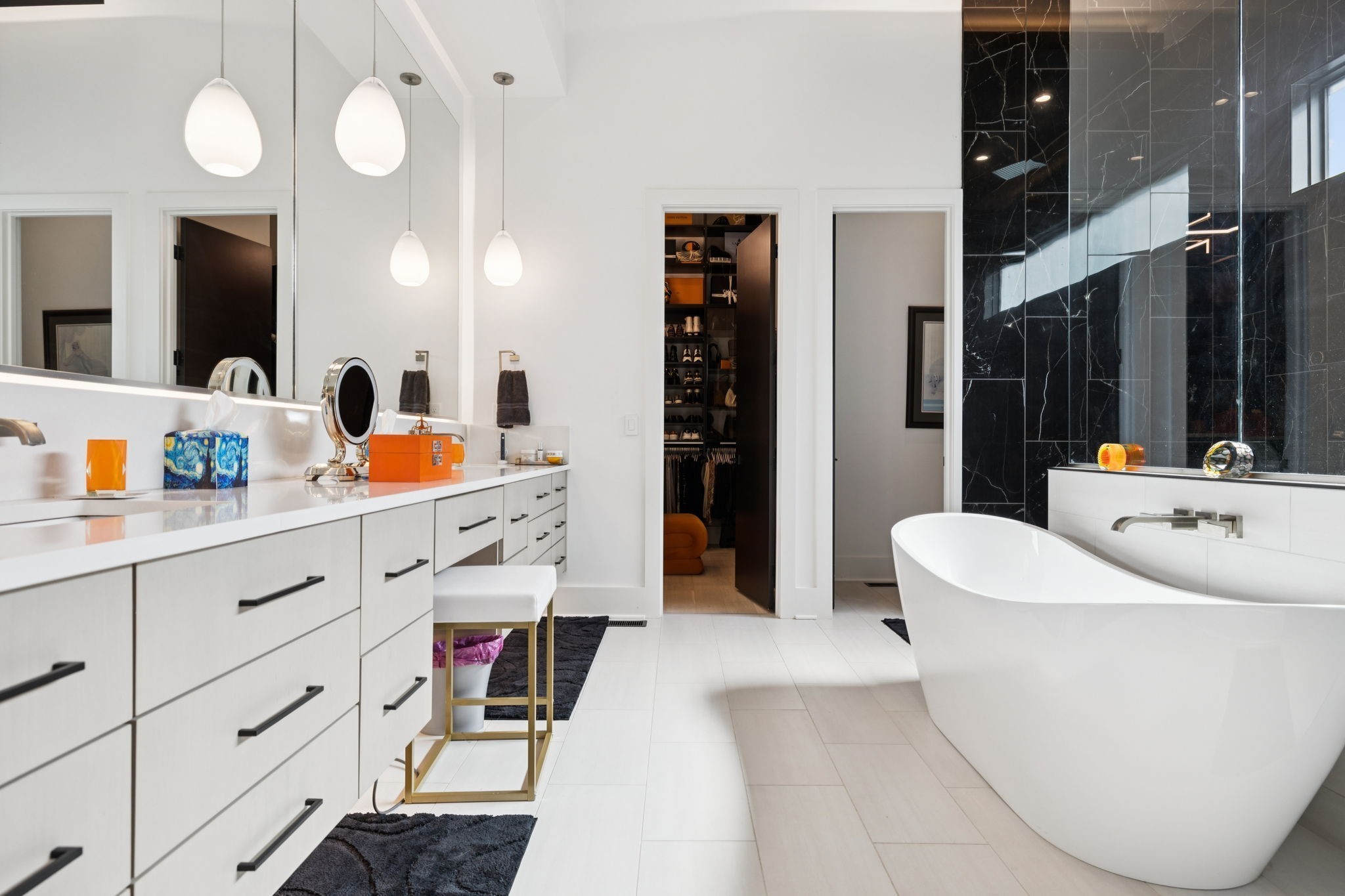 3916 Harding Place Nashville, TN 37215 - Photo 34 of 85 a bathroom with a sink a mirror and a bathtub