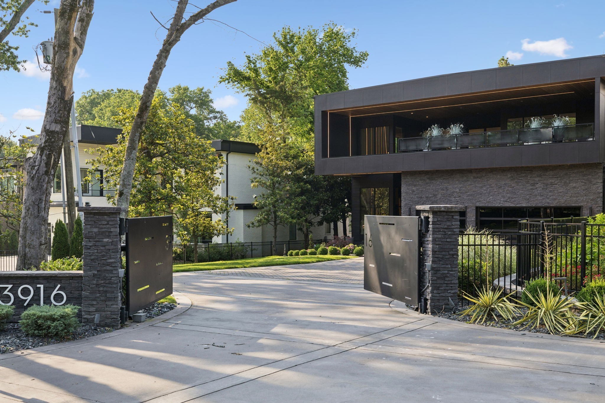 3916 Harding Place Nashville, TN 37215 - Photo 4 of 85 a front view of a house with garden