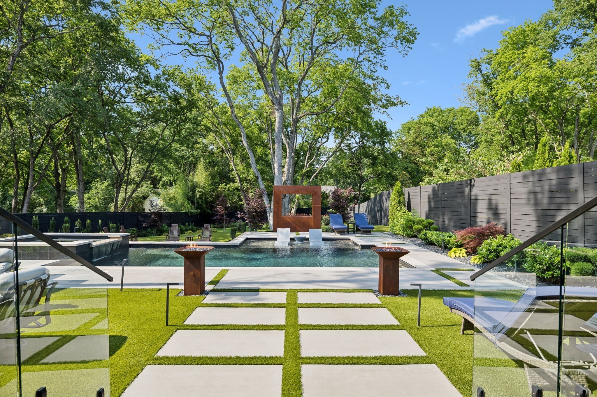 3916 Harding Place Nashville, TN 37215 - Photo 57 of 85 a view of a swimming pool with lounge chairs