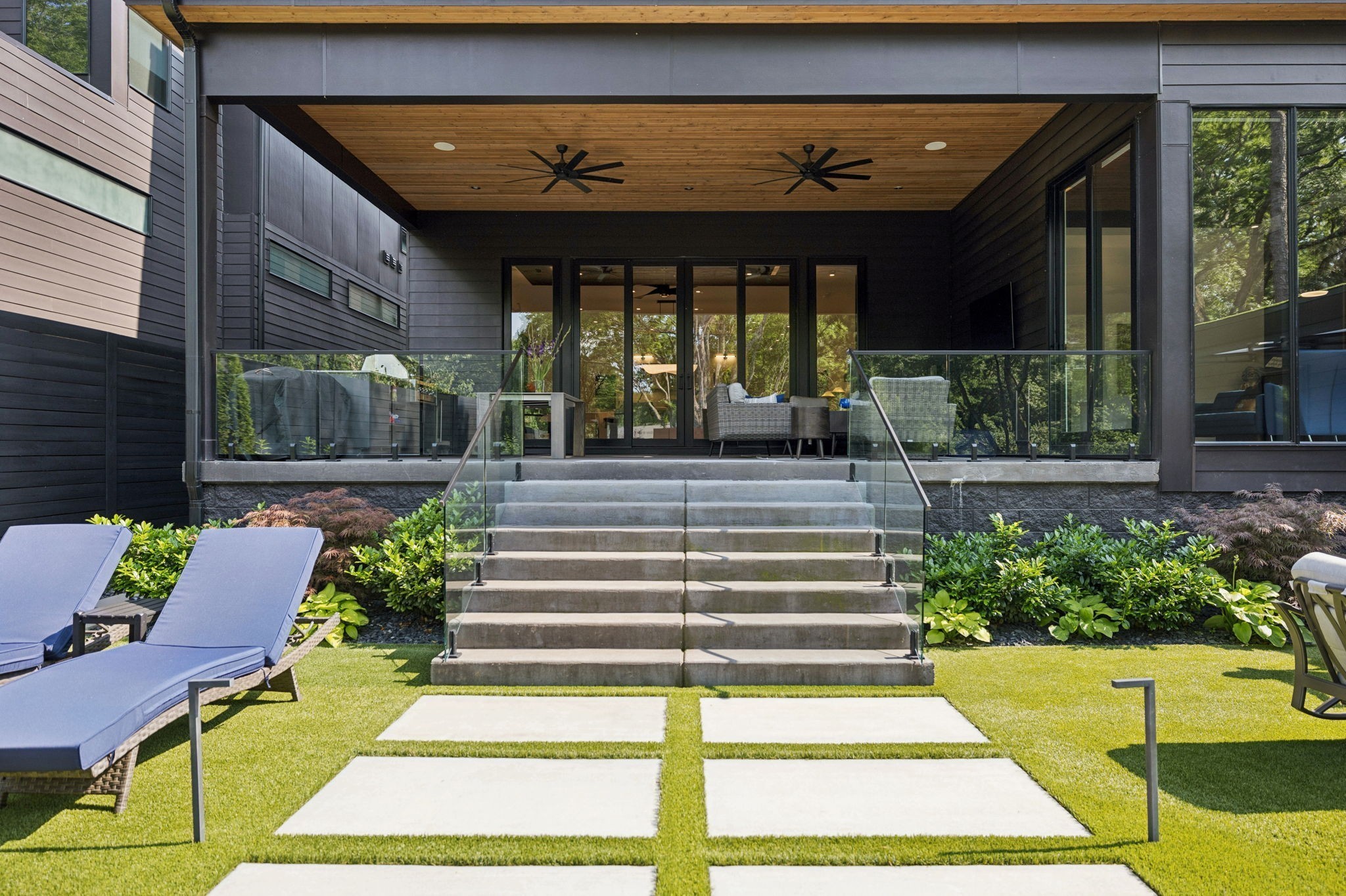 3916 Harding Place Nashville, TN 37215 - Photo 58 of 85 a view of a patio with table and chairs potted plants and floor to ceiling window
