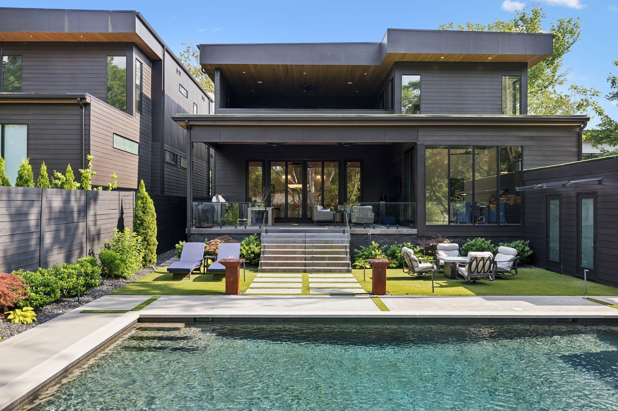 3916 Harding Place Nashville, TN 37215 - Photo 74 of 85 a view of a house with sitting area and swimming pool