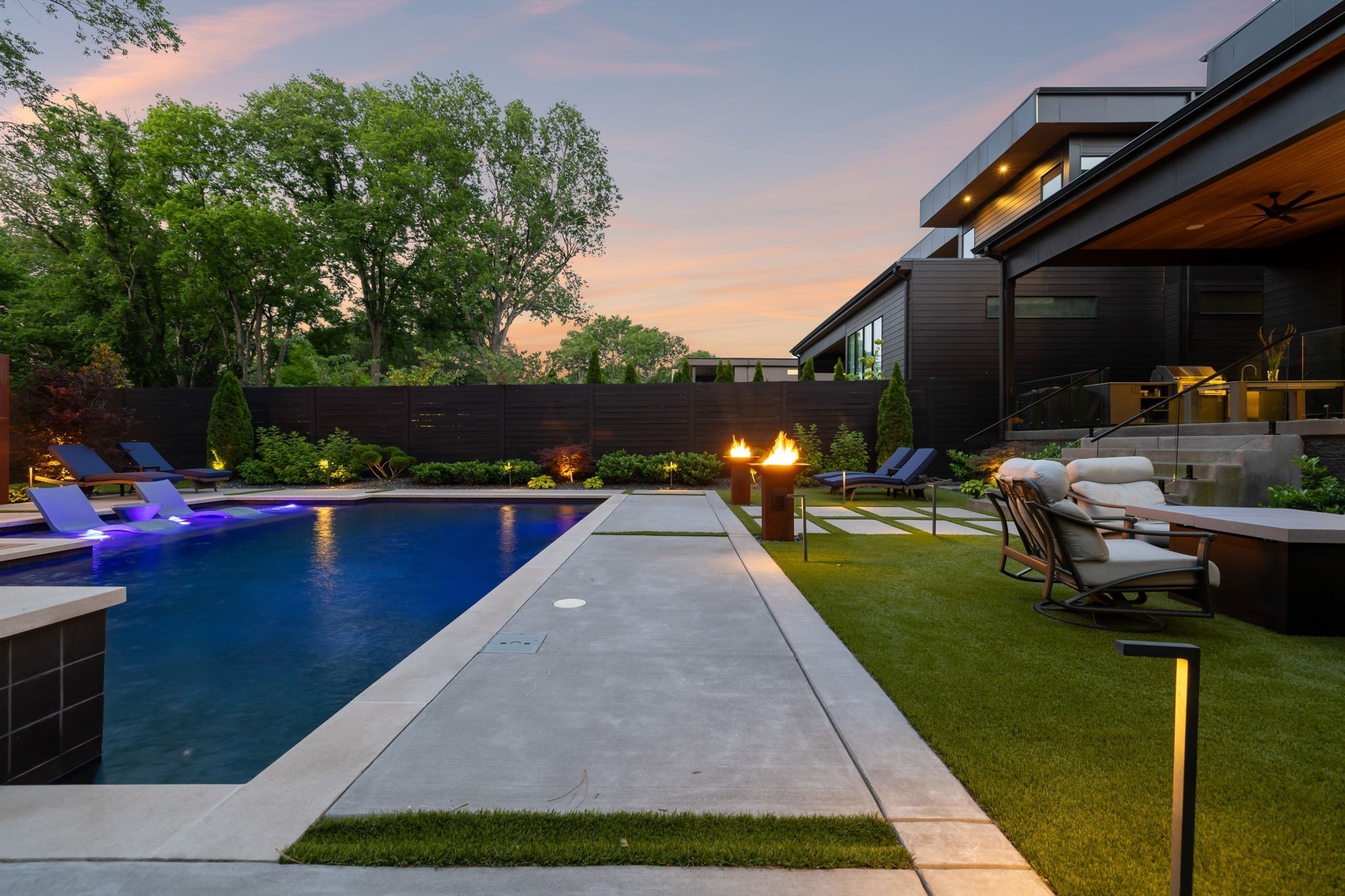 3916 Harding Place Nashville, TN 37215 - Photo 77 of 85 a view of swimming pool with lounge chair and dinning table under an umbrella