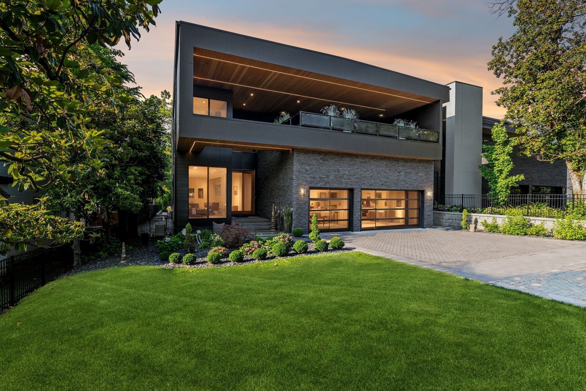 3916 Harding Place Nashville, TN 37215 - Photo 81 of 85 a front view of a house with a yard and outdoor seating
