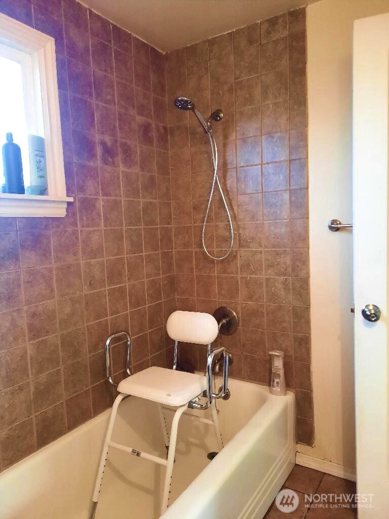 913 East 7th Street Port Angeles, WA 98362 - Photo 12 of 17 a bathroom with a sink a toilet and shower