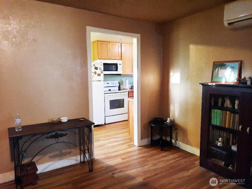 913 East 7th Street Port Angeles, WA 98362 - Photo 6 of 17 a view of a workspace with furniture and wooden floor