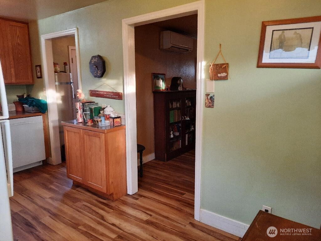 913 East 7th Street Port Angeles, WA 98362 - Photo 10 of 17 a view of a hallway with wooden floor and cabinets
