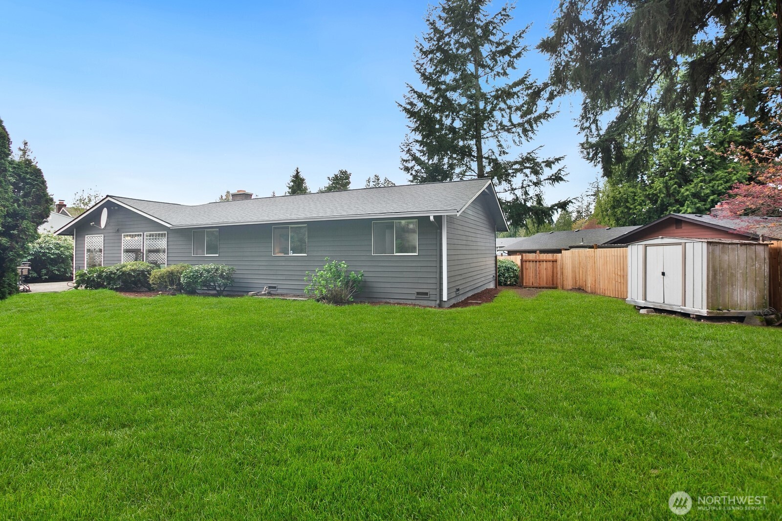 12311 Southeast 96th Place Renton, WA 98056 - Photo 17 of 20 a view of a house with backyard and garden