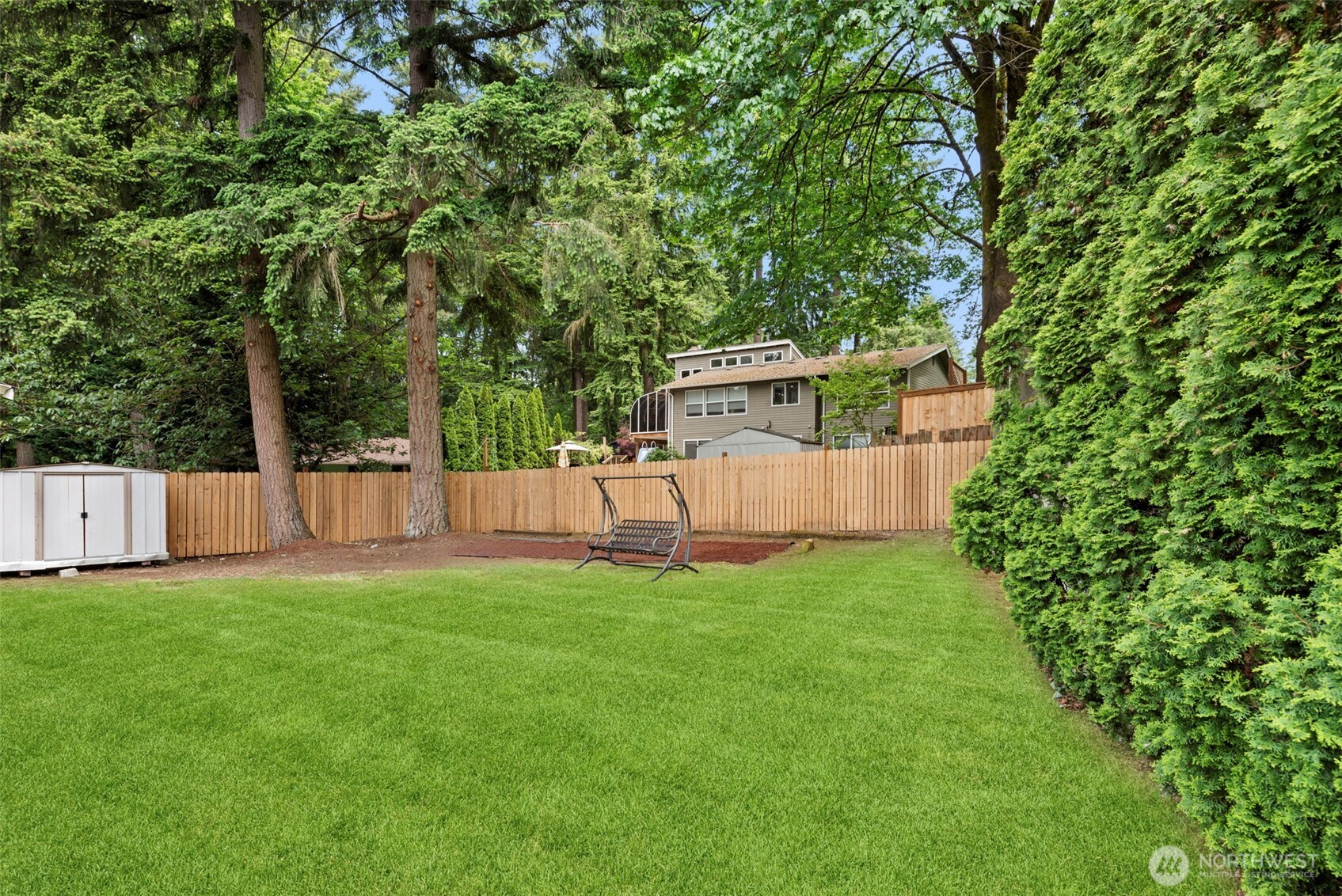 12311 Southeast 96th Place Renton, WA 98056 - Photo 18 of 20 a view of a house with backyard and a tree