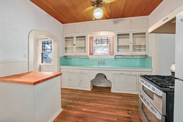 a kitchen with stainless steel appliances granite countertop a stove and a refrigerator