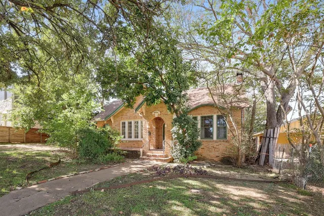 front view of a house with a trees