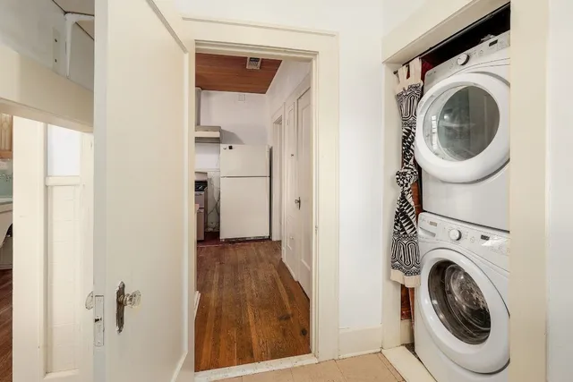 a view of a hallway with washer and dryer