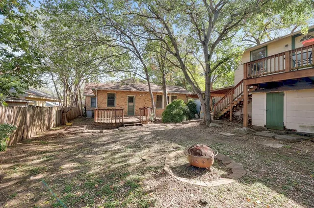 a front view of a house with sitting area