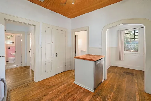 a view of an empty room and wooden floor