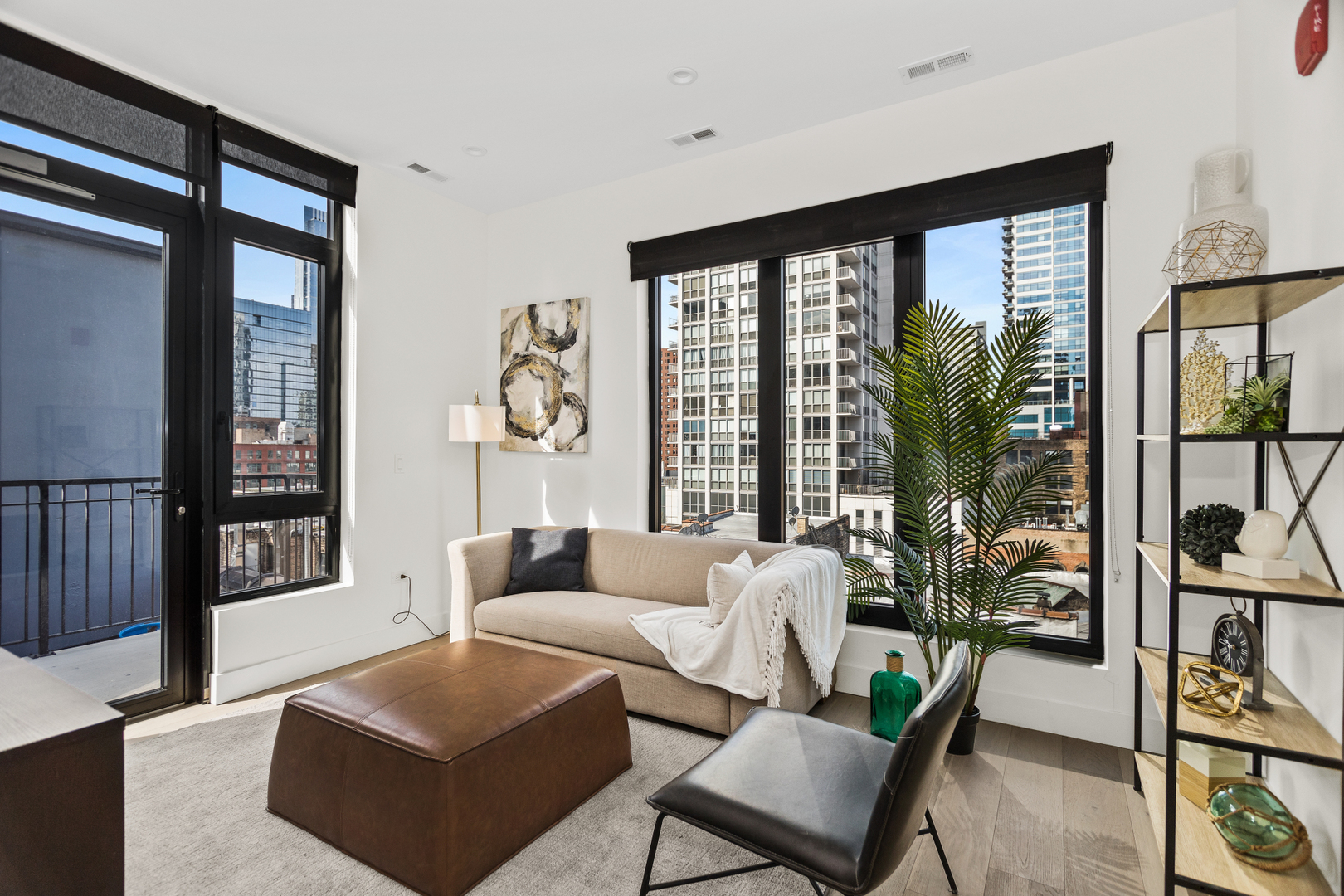 153 West Ohio Street, Unit 504 Chicago, IL 60654 - Photo 2 of 13 a living room with furniture and a large window