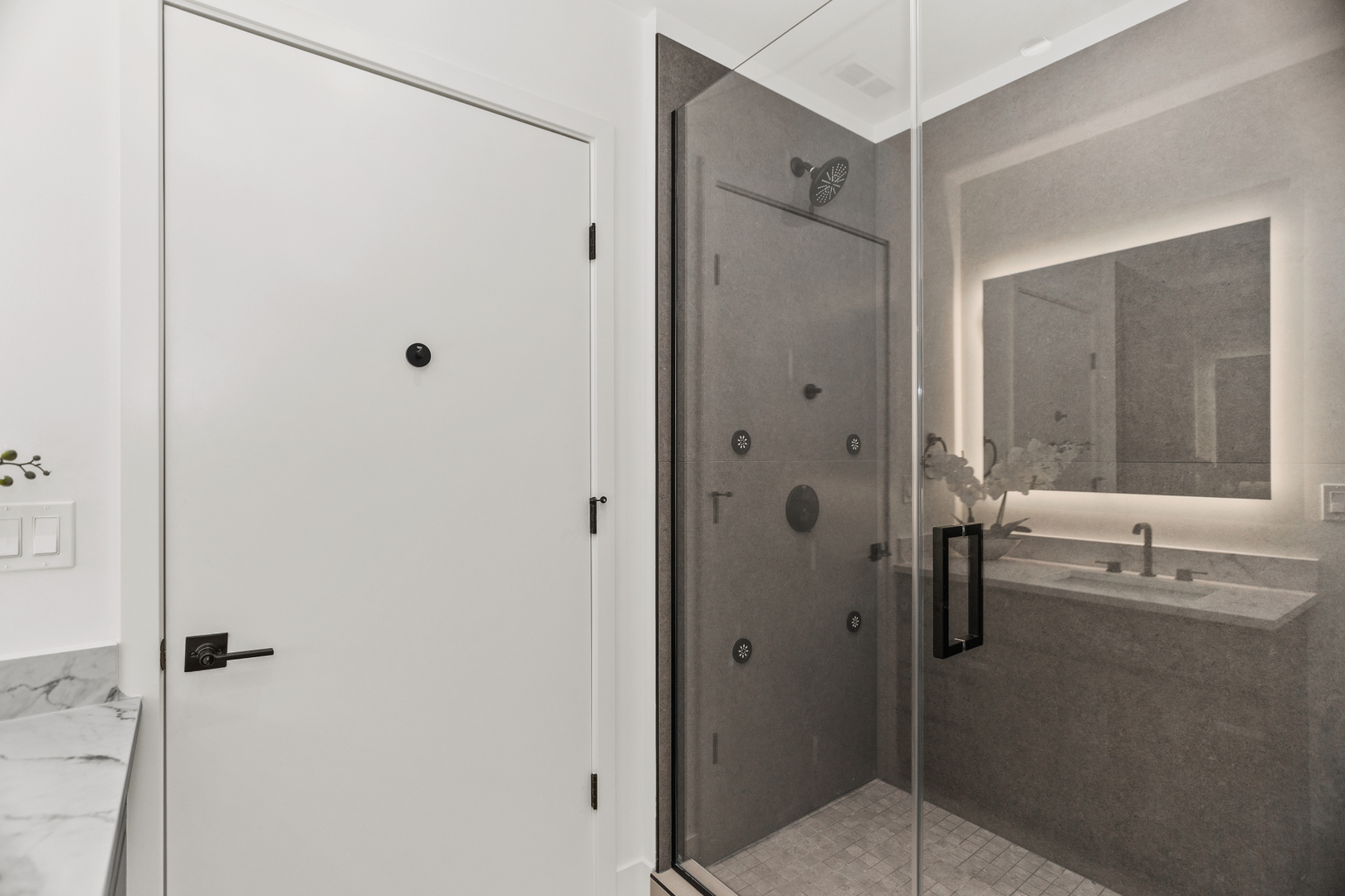 153 West Ohio Street, Unit 504 Chicago, IL 60654 - Photo 6 of 13 a bathroom with a shower and a sink