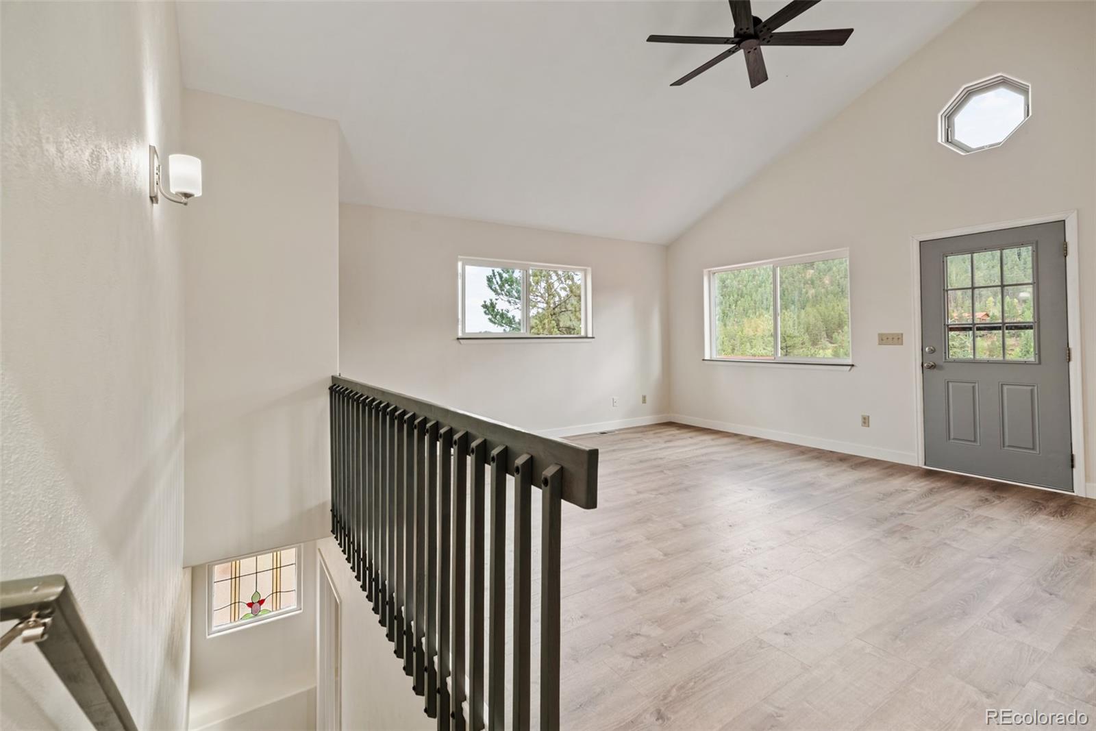 241 Schooley Road Bailey, CO 80421 - Photo 14 of 35 a view of a livingroom with a window and wooden floor