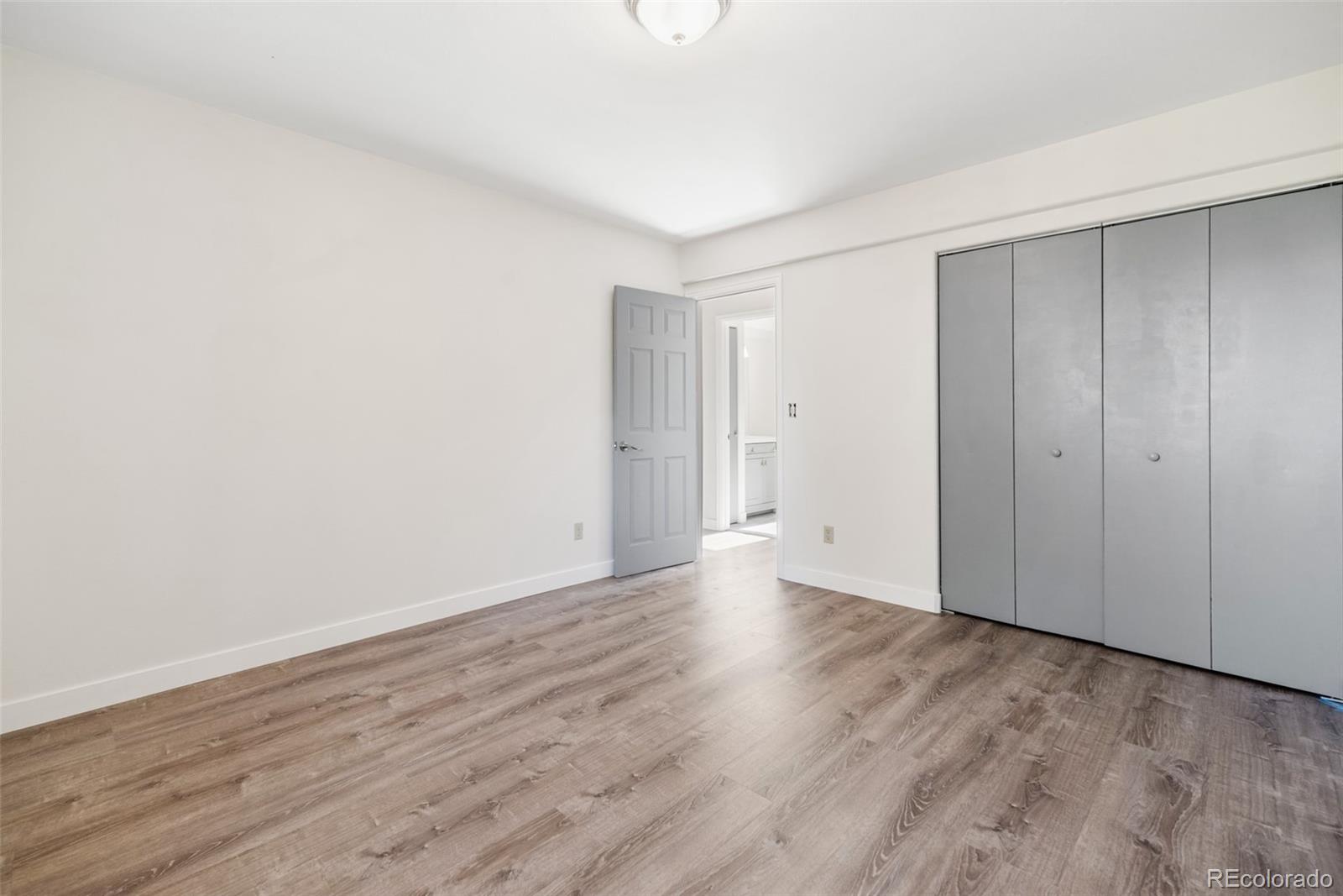 241 Schooley Road Bailey, CO 80421 - Photo 21 of 35 a view of an empty room with wooden floor