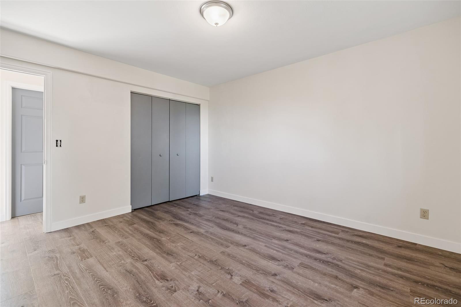 241 Schooley Road Bailey, CO 80421 - Photo 22 of 35 a view of an empty room with wooden floor