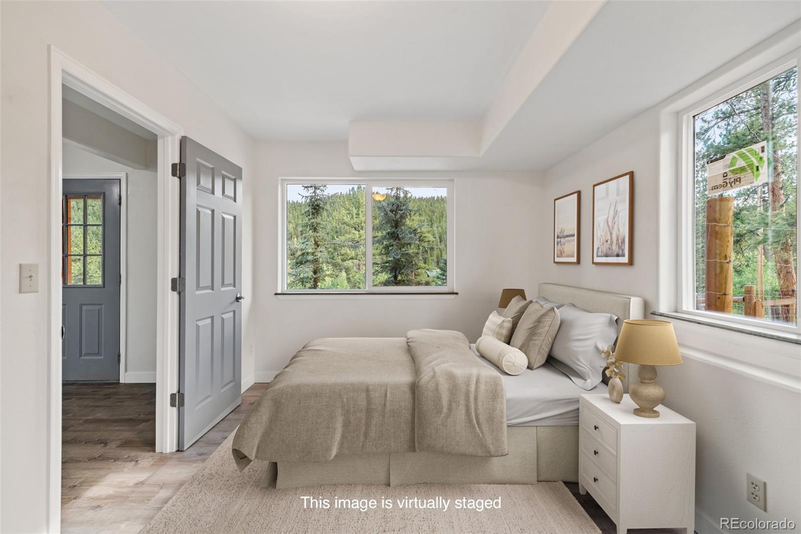 241 Schooley Road Bailey, CO 80421 - Photo 28 of 35 a bedroom with a bed and a window