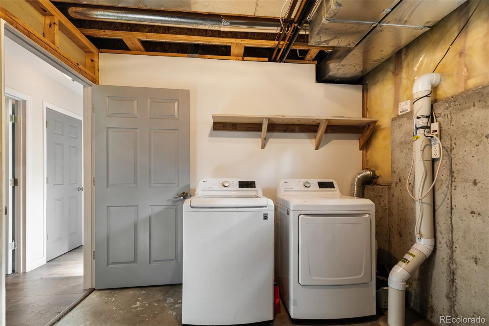 241 Schooley Road Bailey, CO 80421 - Photo 31 of 35 a utility room with dryer and washer