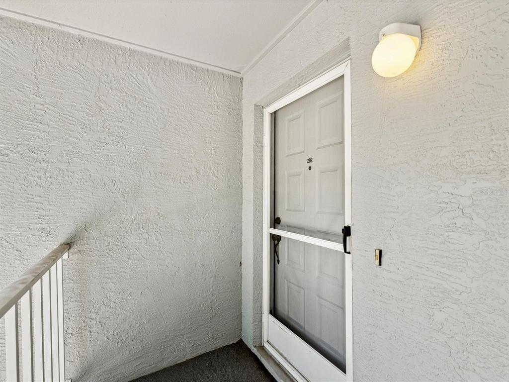 12141 Spartan Way, Unit 202 Hudson, FL 34667 - Photo 11 of 45 a bathroom with a shower