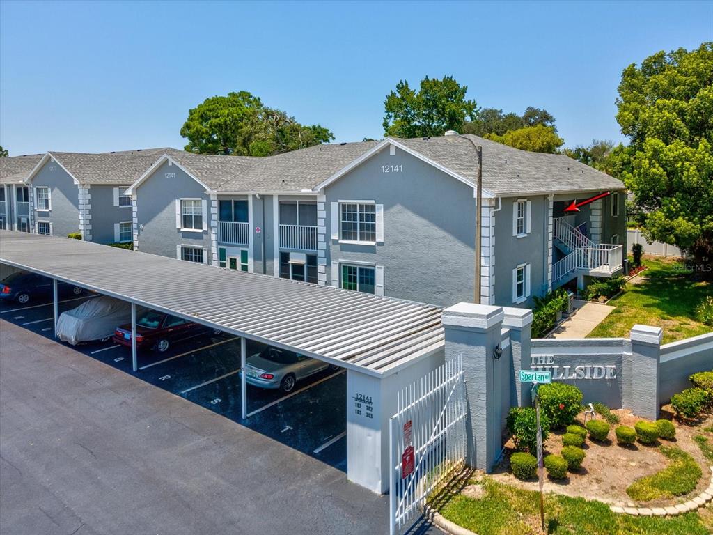 12141 Spartan Way, Unit 202 Hudson, FL 34667 - Photo 2 of 45 a aerial view of a house yard and balcony
