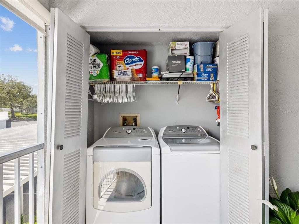 12141 Spartan Way, Unit 202 Hudson, FL 34667 - Photo 25 of 45 a utility room with dryer and washer