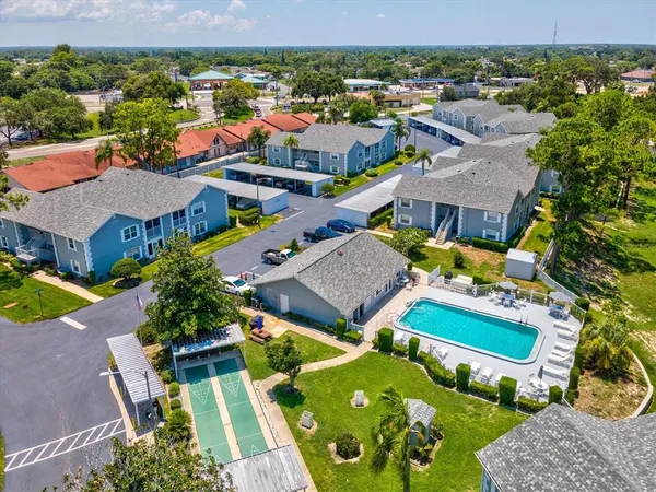 an aerial view of residential houses with outdoor space