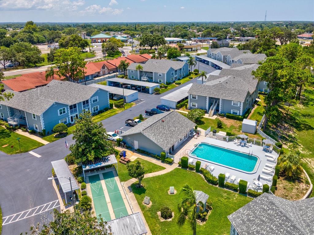 12141 Spartan Way, Unit 202 Hudson, FL 34667 - Photo 3 of 45 an aerial view of residential houses with outdoor space
