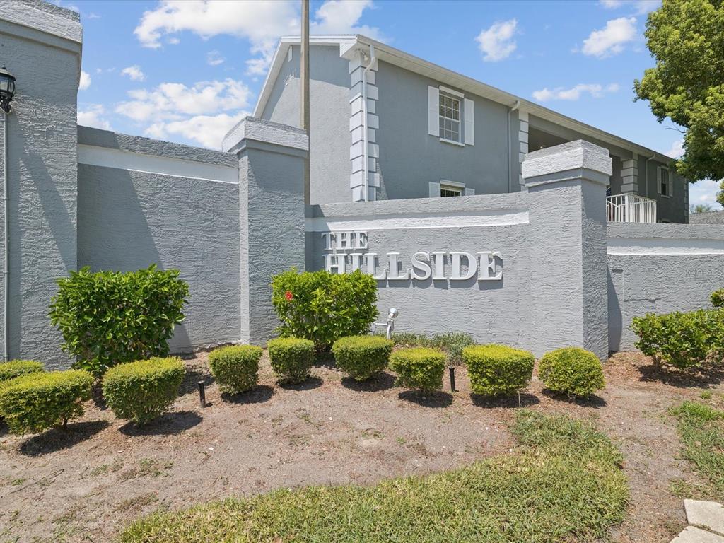 12141 Spartan Way, Unit 202 Hudson, FL 34667 - Photo 32 of 45 a sign on the side of a building