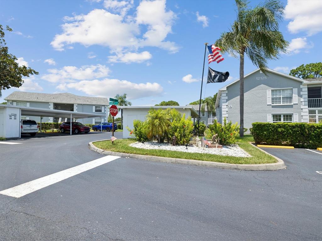 12141 Spartan Way, Unit 202 Hudson, FL 34667 - Photo 40 of 45 a view of street with parked cars