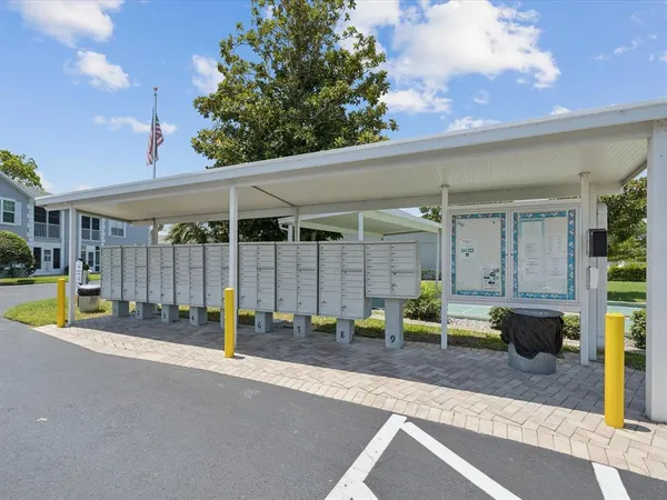 a view of a swimming pool with an outdoor seating