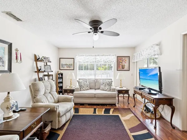 a kitchen with stainless steel appliances granite countertop a sink a stove and refrigerator