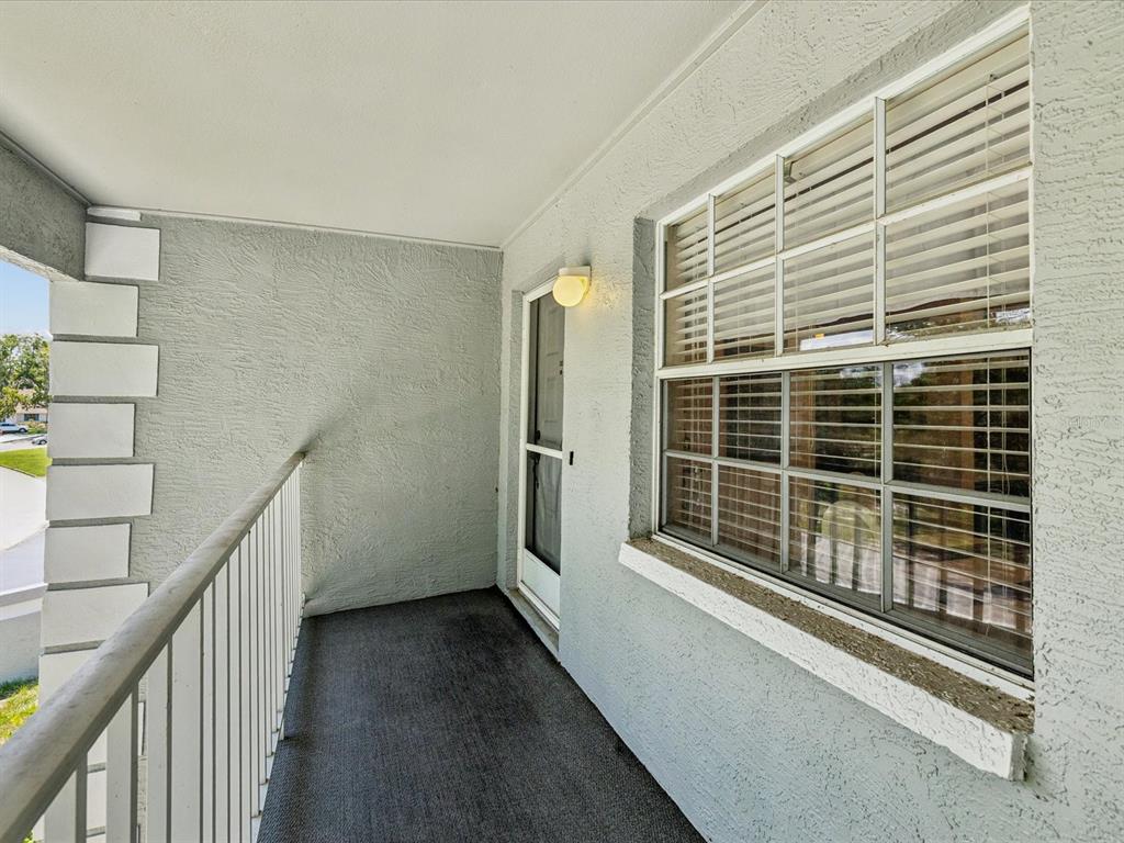12141 Spartan Way, Unit 202 Hudson, FL 34667 - Photo 10 of 45 a view of a balcony with door