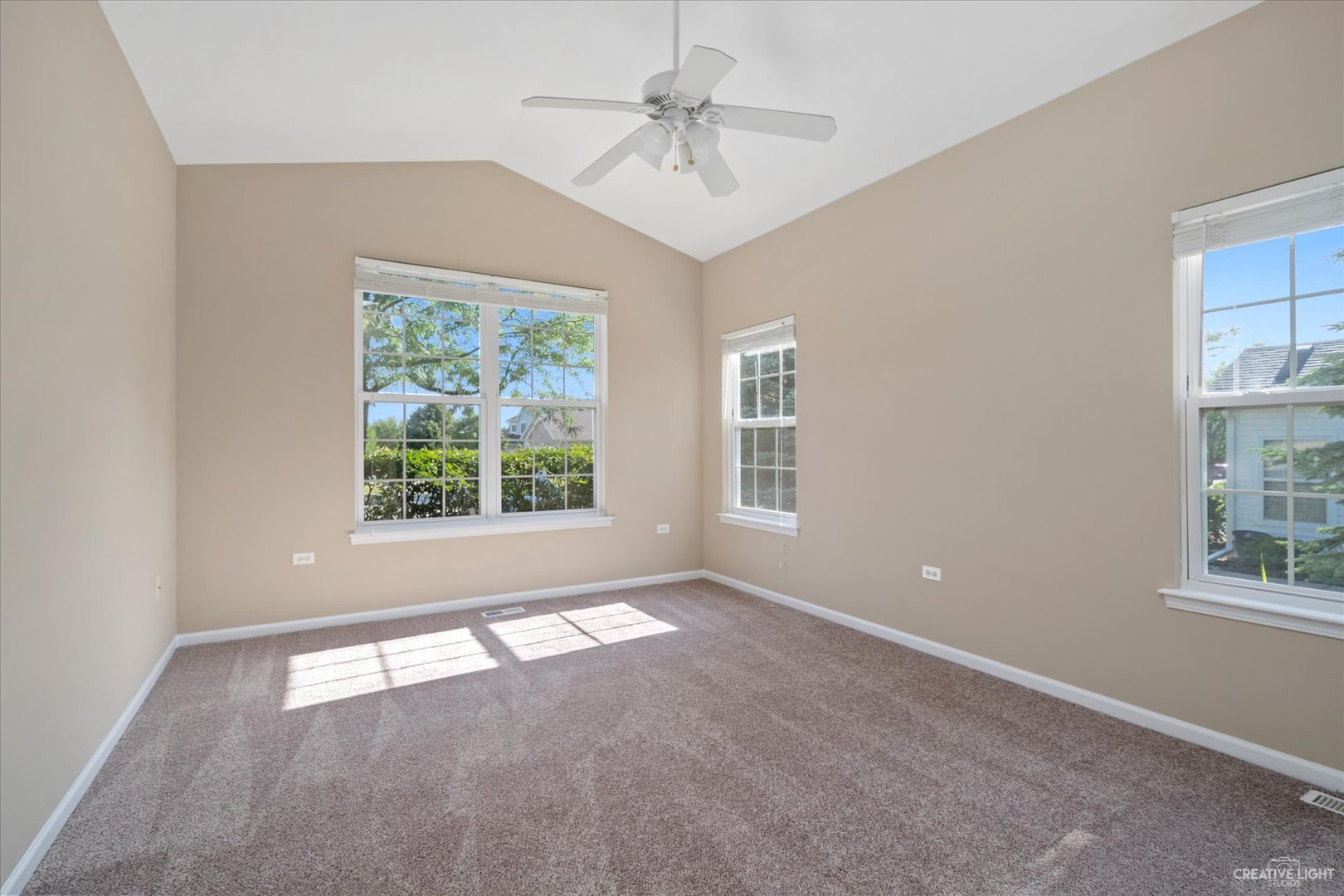 47 Rolling Oaks Road, Unit F Sugar Grove, IL 60554 - Photo 13 of 21 a view of an empty room with a window