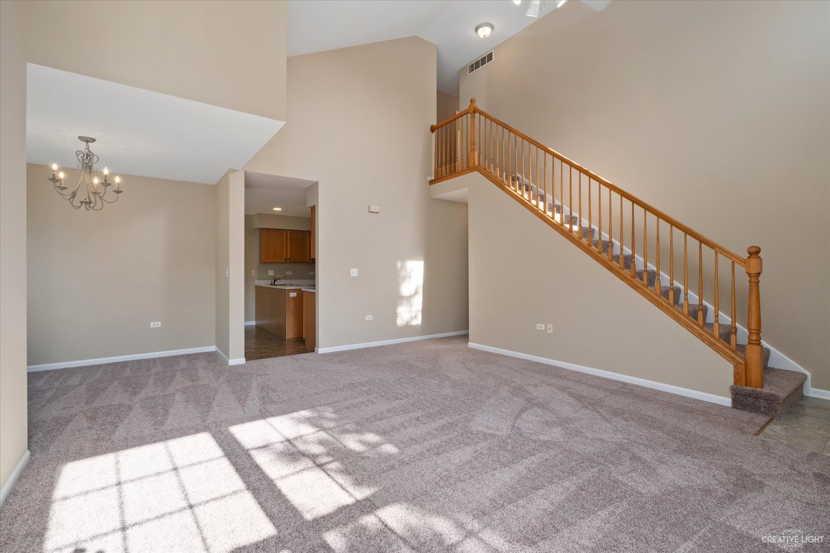 47 Rolling Oaks Road, Unit F Sugar Grove, IL 60554 - Photo 5 of 21 a view of a hallway with staircase