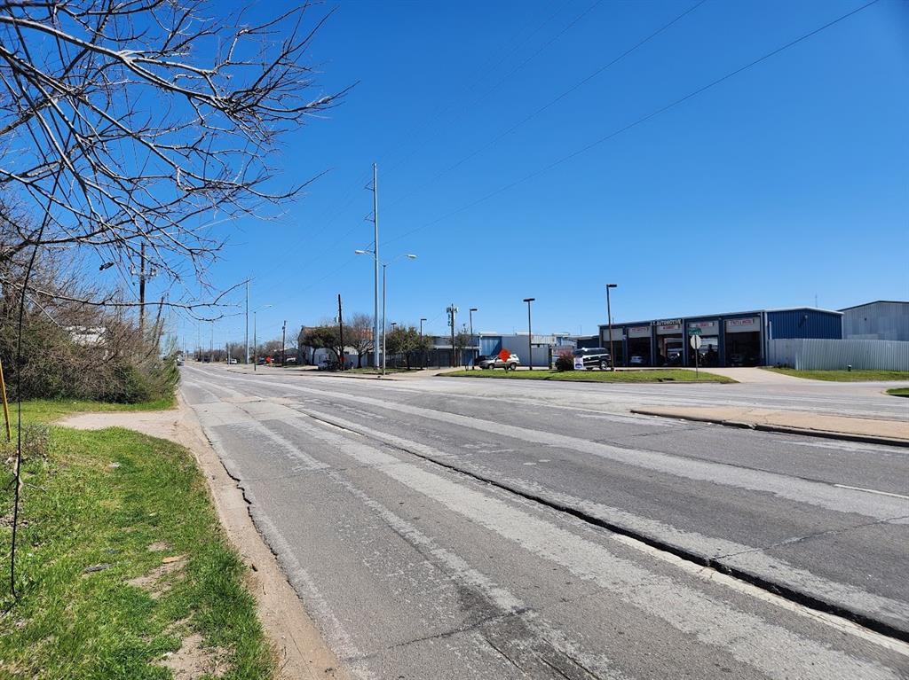 View of street with curbs and street lighting